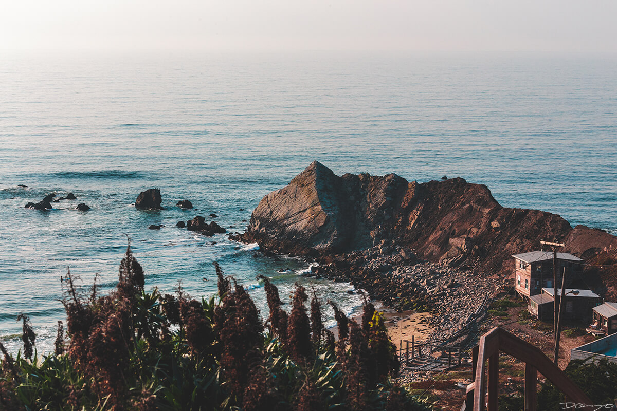 Lone Surfer in Sheltered Cove Private Beach, CA