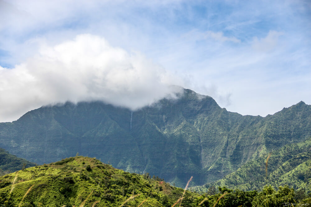 A waterfall high in the mountain ridges on the Napali Coast, Hawaii