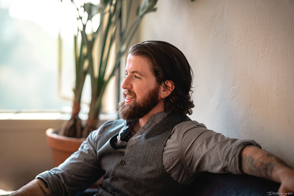 Portrait photos of Oliver Slate-Greene in a Berkeley, California studio apartment.